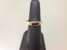 A Continental yellow gold two-stone ring, the tapering band stamped "750" and set with a pair of
