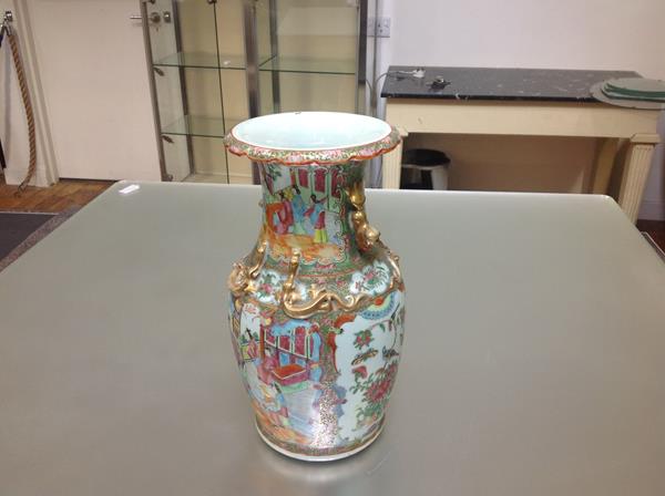 A Canton Export famille rose vase, c. 1900, of baluster form, with everted scalloped rim, moulded