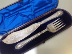 A cased pair of Victorian silver bladed and handled fish servers, Atkin Brothers, Sheffield 1880,