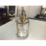 A French cast brass hall lantern light of cylinder form with acorn and bow mounted frame, with