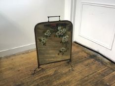 A Victorian brass painted mirror back firescreen raised on shaped supports (one pad foot missing) (