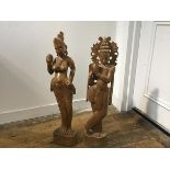 A pair of Indonesian carved teak wood figures of Godesses (h.70cm)