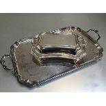 An Epns scalloped rectangular two handled tea tray (54cm x 31cm) and an Epns entree dish with twin