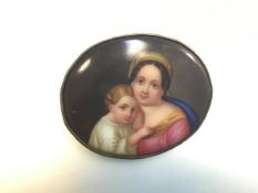 A 19thc Continental oval enamelled porcelain Vienna style brooch depicting a mother and child (5cm x