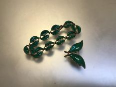 A Norwegian sterling silver green enamelled leaf brooch and matching bracelet, marked DA,