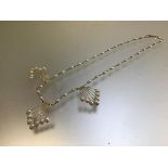 A 543 stamped yellow metal freshwater pearl and triple frond necklace (22cm)