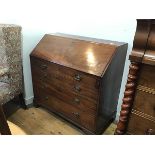 A George III mahogany bureau, the plain top above a fall front enclosing a fitted interior above