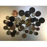 A collection of miscellaneous coins including a George III crown, a Victorian crown, a Queen