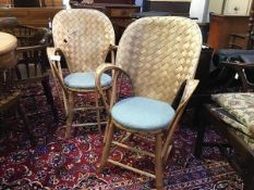 A pair of Scandinavian bamboo and birch lattice back garden chairs with upholstered padded seats,