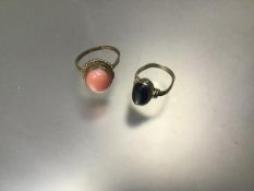 A 9ct gold pink coral set dress ring (Q) (3.46g) and a Continental yellow metal star sapphire oval