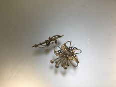 A yellow metal openwork spiral brooch mounted seed pearls and an Edwardian yellow metal seed pearl