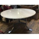 Possibly Johanson Design, Sweden, a dining table with circular travertine top on chromium m plated