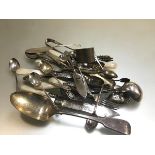 A collection of Epns including mother of pearl fish knives and forks, sugar tongs, apostle spoons, a