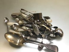 A collection of Epns including mother of pearl fish knives and forks, sugar tongs, apostle spoons, a