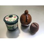 A pottery money bank, a pottery money bank barrel and a handpainted pottery jam dish and cover