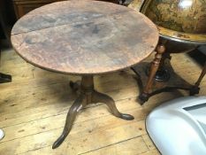 A George III elm snap top occasional table, the circular top with moulded edge (a/f), on turned