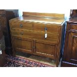 An Edwardian mahogany wash stand style ledgeback chest, the top with boxwood strung border above two