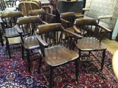 A set of six mahogany spindle back captain style chairs by W Walker & Son, Bunhill Row, London, with