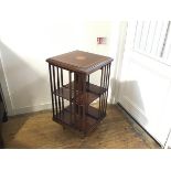 A reproduction Edwardian style mahogany revolving bookcase with satinwood inlaid moulded square top,