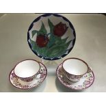 A Highland Stoneware decorated tulip plate (d.20cm) and a pair of 19thc gaudy lustre cups and