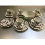 A 1950s Coalport nineteen piece tea service decorated with handpainted floral sprays, with