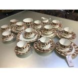 A Paragon thirty four piece tea service decorated with rose and gilt border