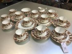 A Paragon thirty four piece tea service decorated with rose and gilt border