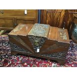 An Eastern camphorwood carved kist, the rectangular top with relief carved nautical scene, with