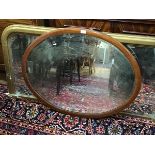 A Victorian mahogany inlaid oval wall mirror with bevelled glass plate (74cm x 94cm)