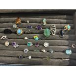 A collection of white metal paste and semi precious stone mounted rings including turquoise,