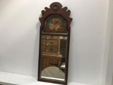 A reproduction walnut fretwork Queen Anne style arched mirror with shell surmount and painted