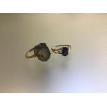 A 9ct gold amethyst set ring (M), and a 9ct gold cairngorm oval mounted ring (L/K) (6.53g) (2)