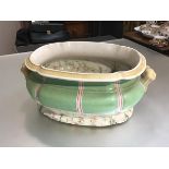 An English china foot bath of scalloped form with twin handles to side with faux marble decorated