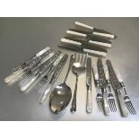 Six pairs of Epns engraved fruit knives and forks, a pair of servers and a set of six stainless