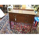 An Edwardian mahogany ledgeback chest, the top with crossbanded chequerboard inlaid border above two