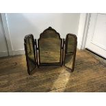 A 1920s walnut triple dressing mirror with Queen Anne style arched moulded frame with shell