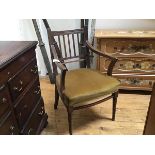 A 19thc oak mahogany spar back open arm carver chair with upholstered seat, on ring turned tapered