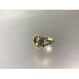 A 19thc yellow metal ring set oval cut foiled citrine (Q) (3.65g)