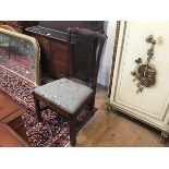 A George III elm country chair with ribbon style top and pierced splat back, with slip in seat, on