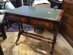 A reproduction mahogany sofa table, the rectangular top with inset green leather gilt tooled skiver,