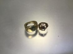 A 9ct gold bombe style ring (4.06g) and a yellow metal ring, unmarked (4.35g)