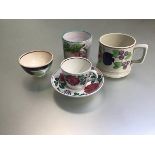 A 19thc style Norman W Franks leaded glaze pottery hand decorated spongeware style mug, a 19thc