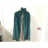 A 1920s turquoise cotton velvet cape with pink satinised velvet lining, with ruched collar and