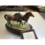 A Royal Worcester limited edition porcelain model group, Galloping Ponies, modelled by Doris