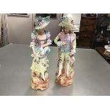 A pair of 19thc Continental Beau and Lady bisque figures, decorated with polychrome enamels (h.38cm.