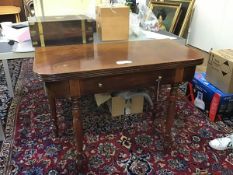 A 19thc mahogany foldover tea table with fluted edge, fitted single frieze drawer, raised on