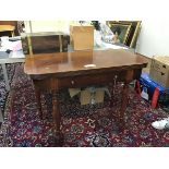 A 19thc mahogany foldover tea table with fluted edge, fitted single frieze drawer, raised on