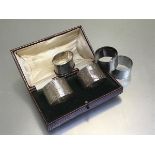 A pair of Birmingham silver engine turned napkin rings, two Epns napkin rings and a Birmingham