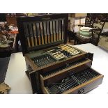 An Edwardian mahogany inlaid canteen containing a suite of Old English pattern Epns flatware (one