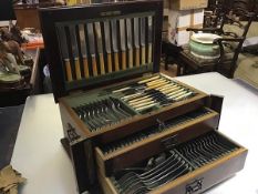 An Edwardian mahogany inlaid canteen containing a suite of Old English pattern Epns flatware (one